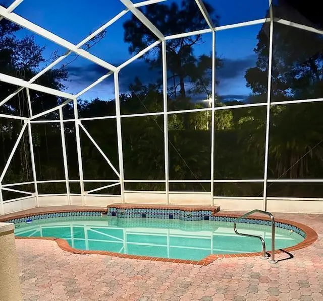 pool at night at 8848 Via Tuscany Drive, Boynton Beach