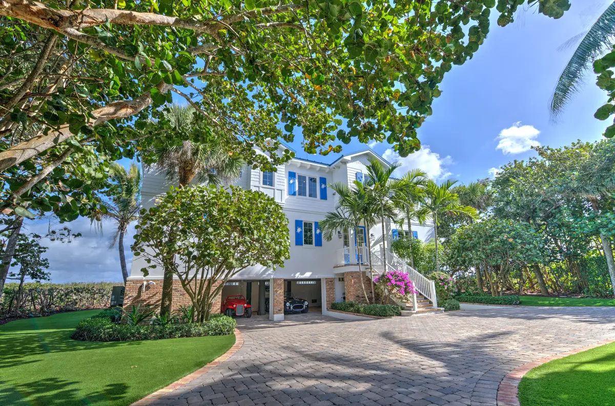 01 Ext Front - Garage Open at 113 N Beach Road, Jupiter Island