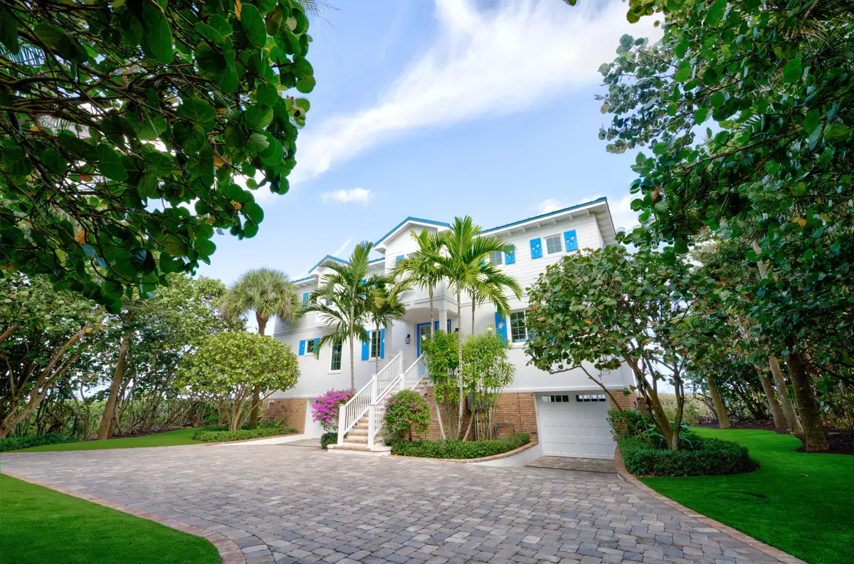 02 Ext Front - Garage closed at 113 N Beach Road, Jupiter Island