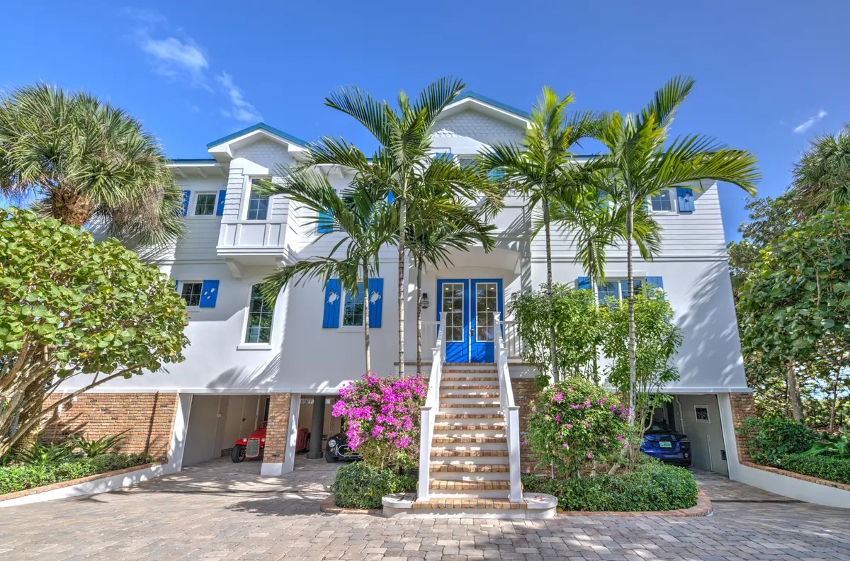 03 Ext Front - Garages Open at 113 N Beach Road, Jupiter Island