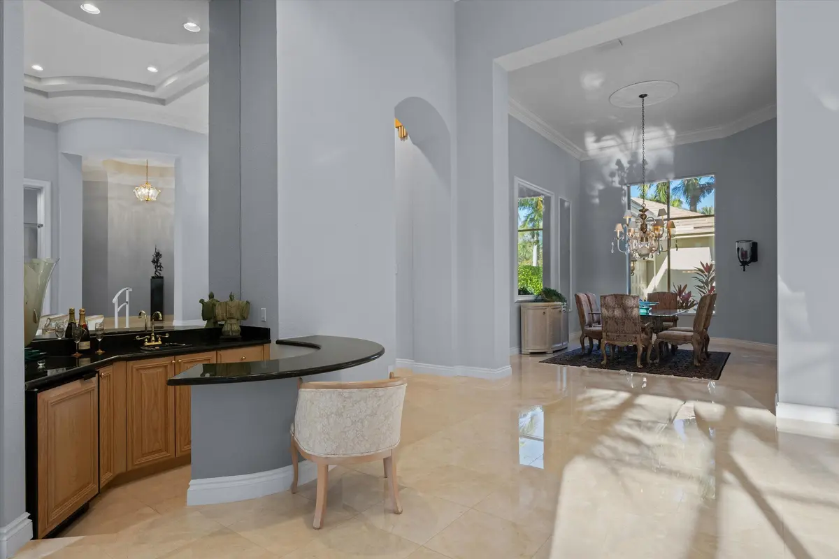Wet bar and dining room at 1648 Cypress Row Drive, West Palm Beach