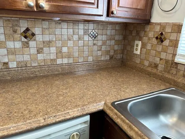 tiled backsplash at 239 Golden River Drive, West Palm Beach