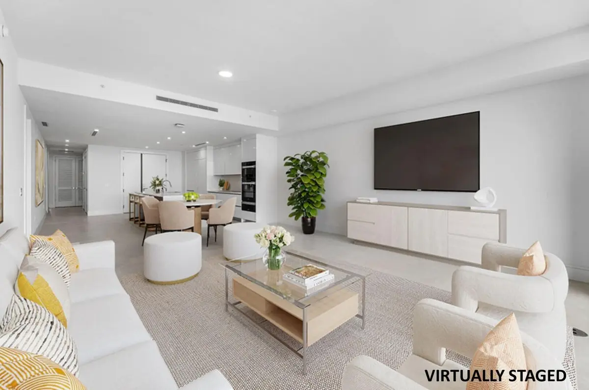 Living & Dining Area Virtually Staged at 220 Lake Shore Drive 1006, Lake Park