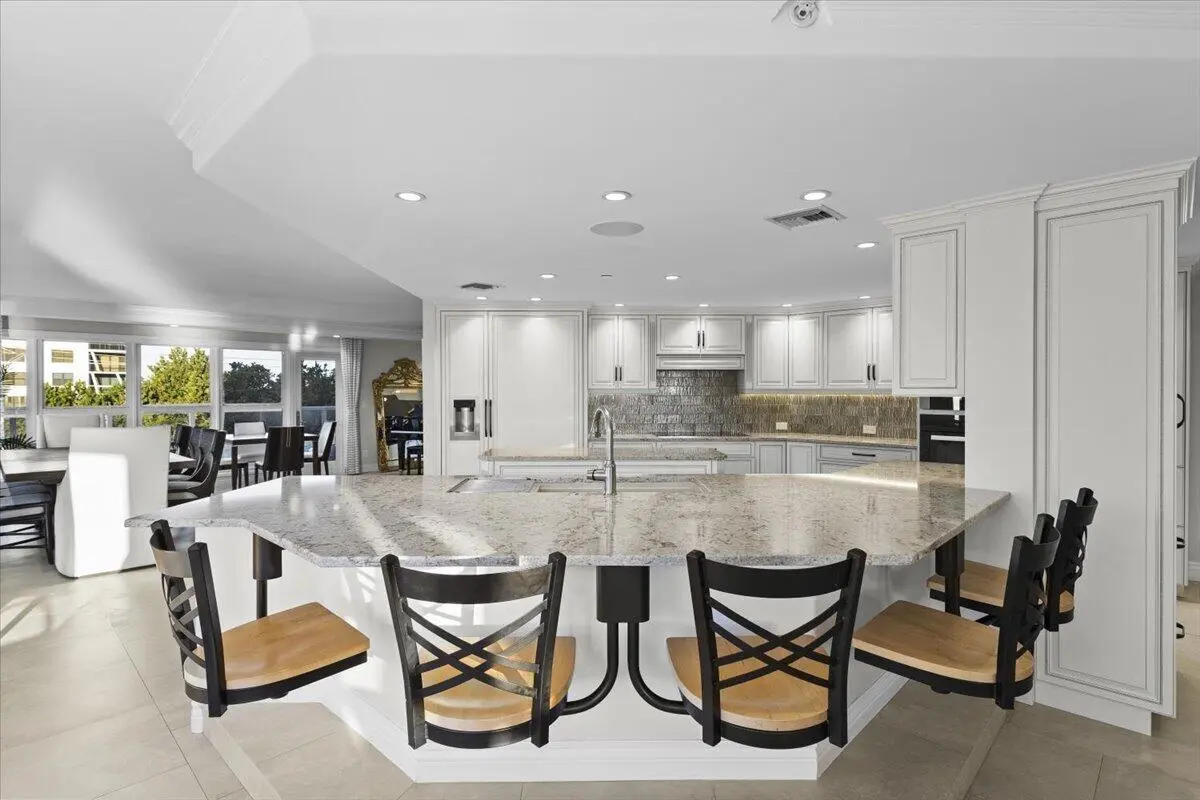 Upper level kitchen island seating at 4605 S Ocean Boulevard 3b, Highland Beach