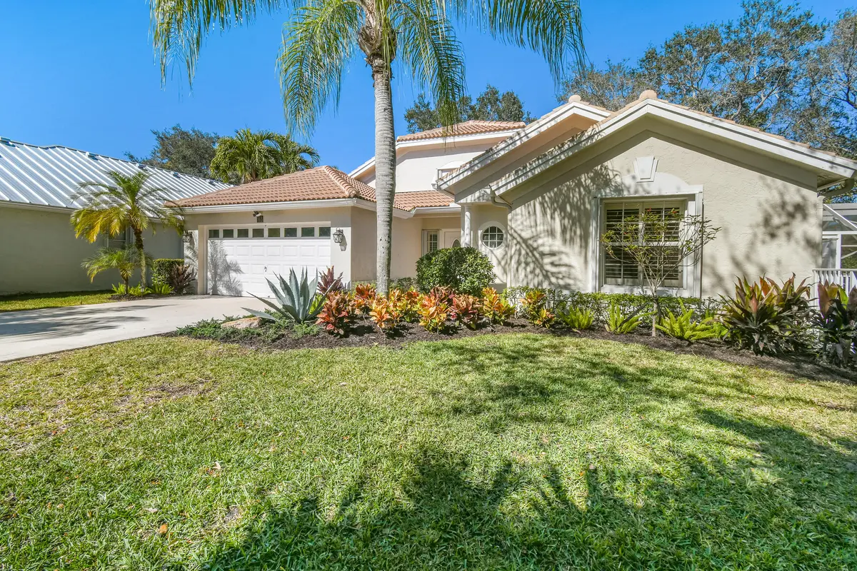 Exterior front of home at 163 Spoonbill Court, Jupiter