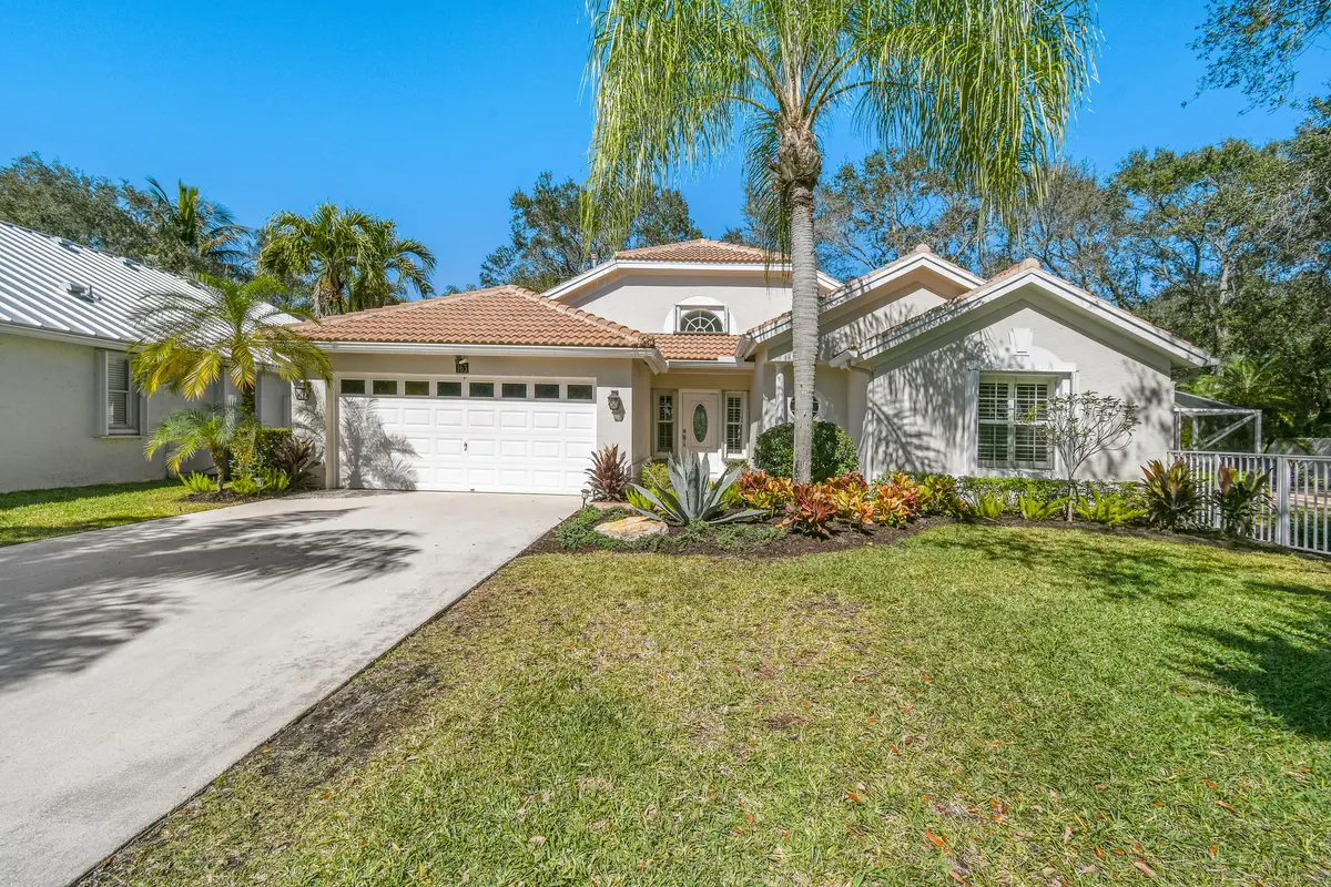 Front of home at 163 Spoonbill Court, Jupiter