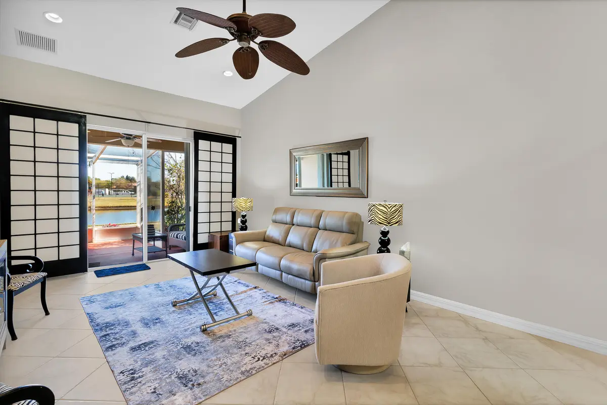 Living Room towards lanai at 6515 Oxford Circle 103, Vero Beach