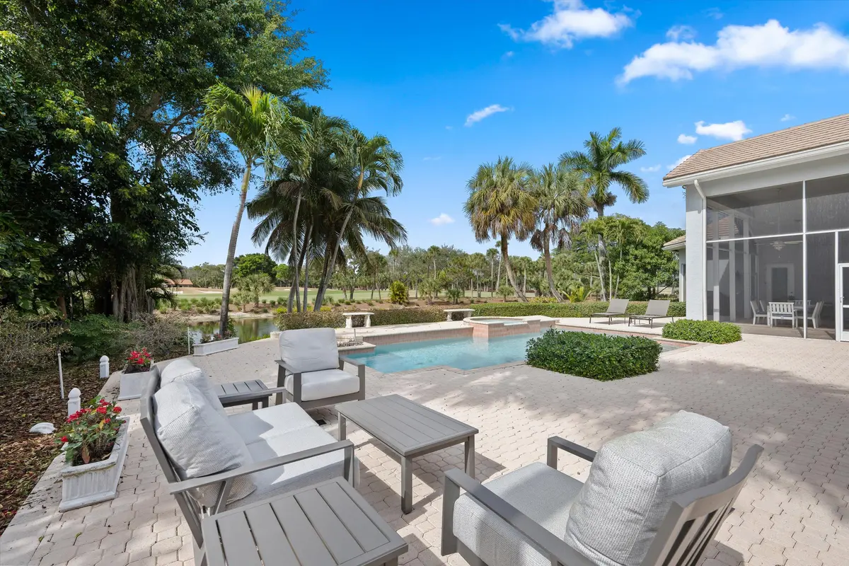 Patio/pool w/water & multiple fairways at 1362 Breakers West Boulevard, West Palm Beach