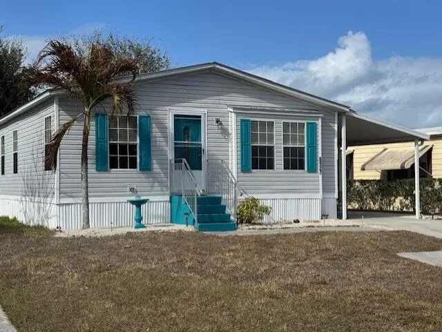 Front of home at 6927 SE Delegate Street, Hobe Sound