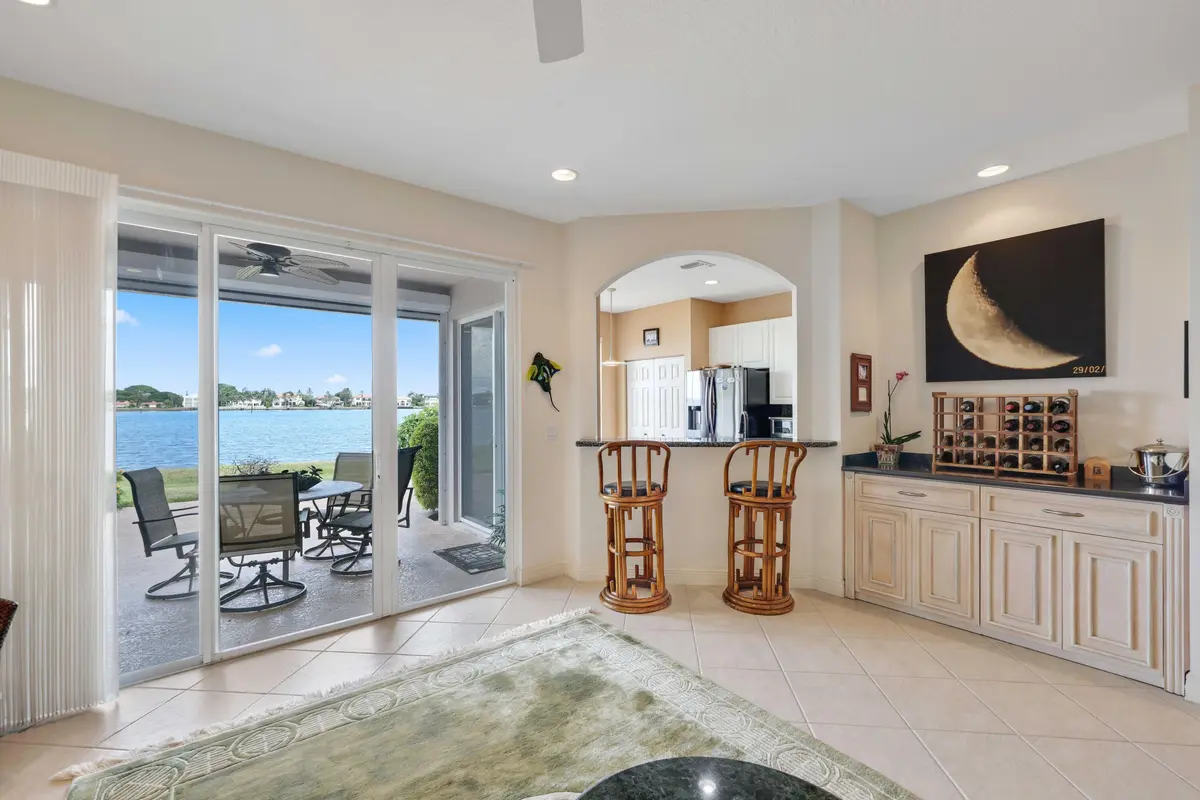 Family Room/Kitchen/Patio at 132 Las Brisas Circle, Hypoluxo
