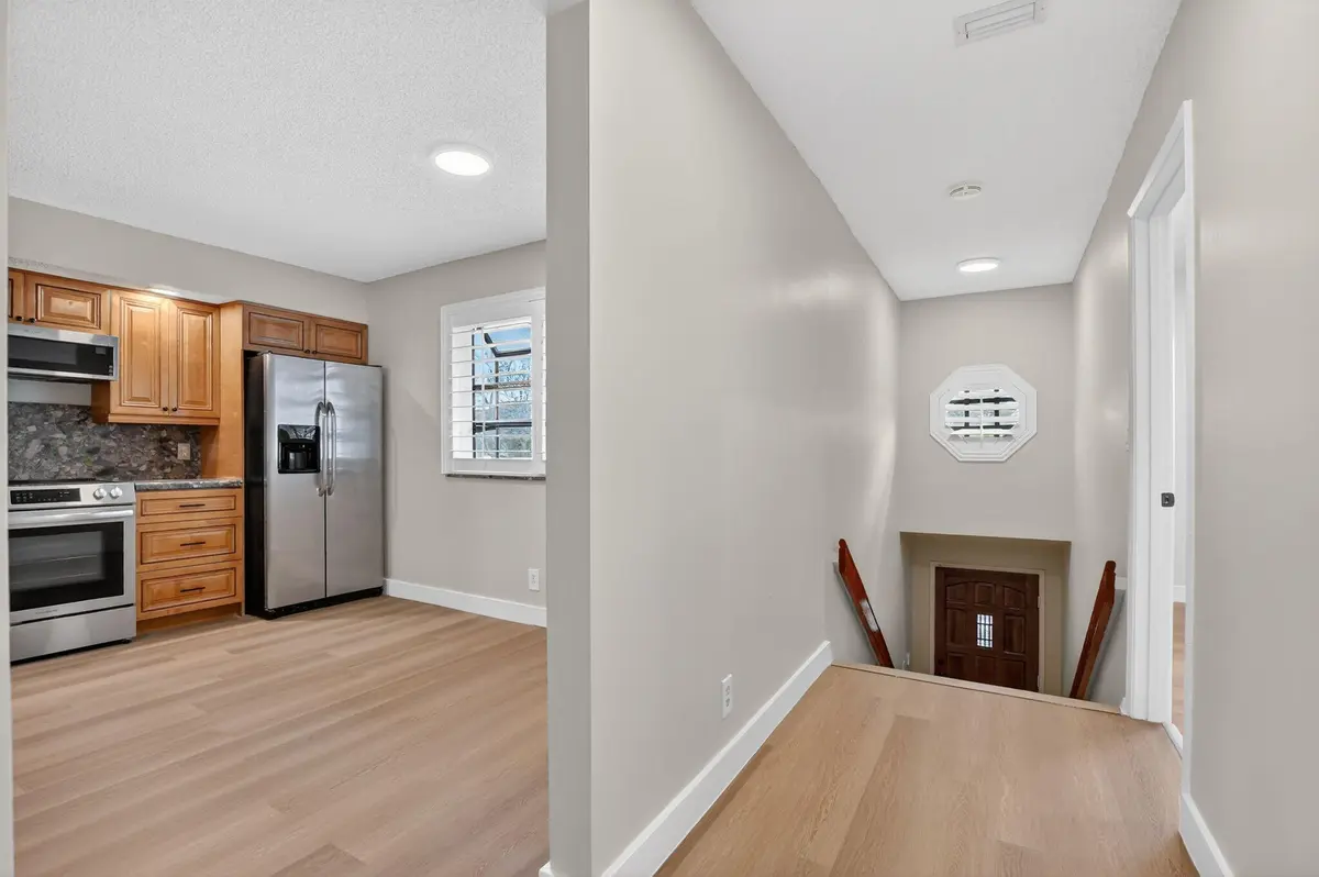 Foyer and kitchen at 7818 La Mirada Drive 7818, Boca Raton