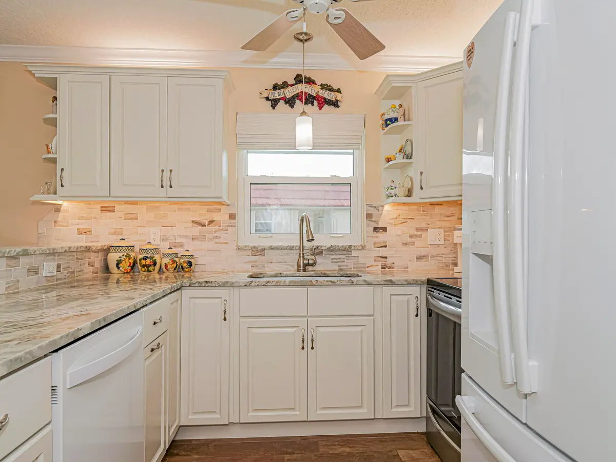 56 Woodland Dr with kitchen sink and ref at 56 Woodland Drive 201, Vero Beach