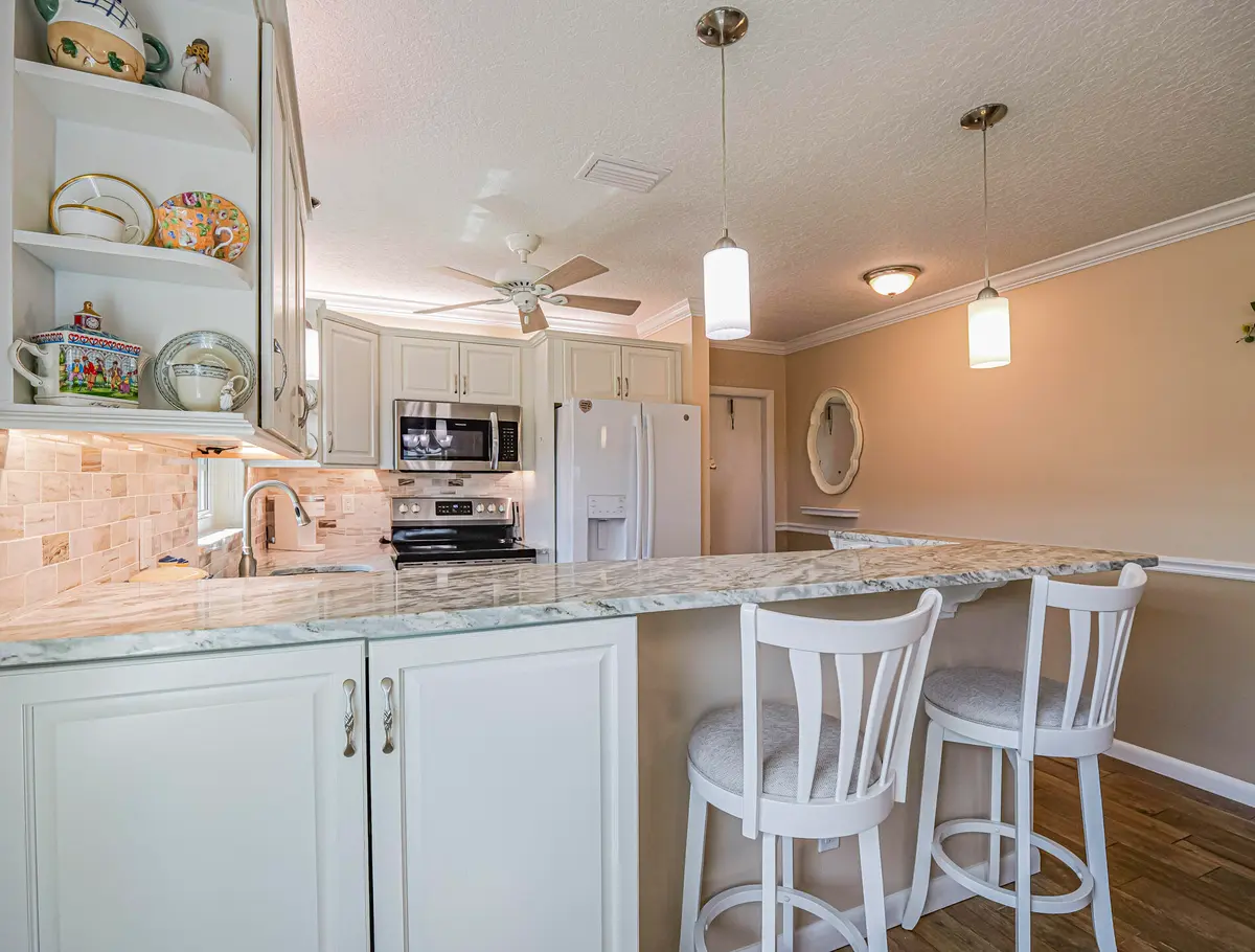 56 woodland Kitchen with corner cabinet at 56 Woodland Drive 201, Vero Beach