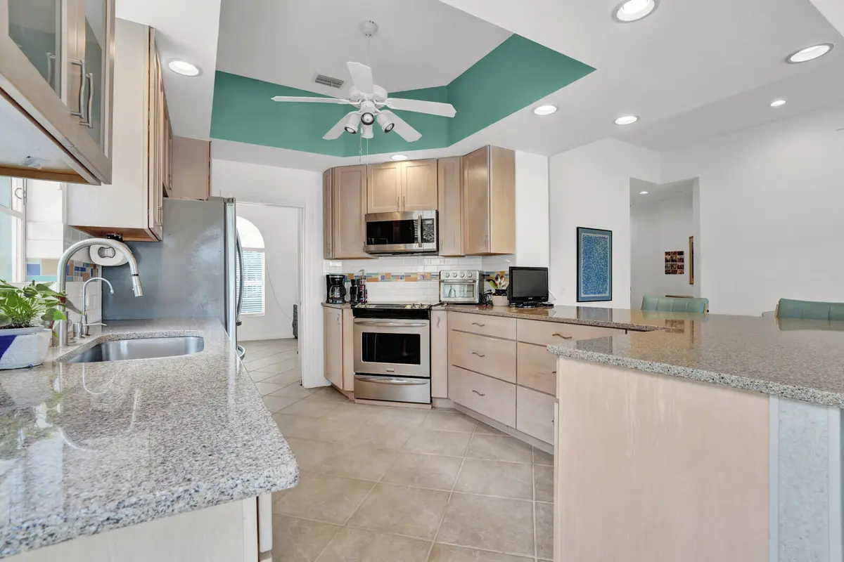 Kitchen with extended island at 9001 SE La Creek Court, Hobe Sound
