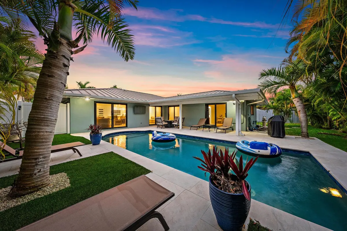 Pool & Back Exterior at 1120 Singer Drive, Riviera Beach