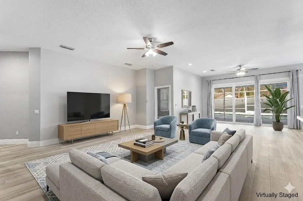 Hampton living room staged at 132 E Hampton Way, Jupiter