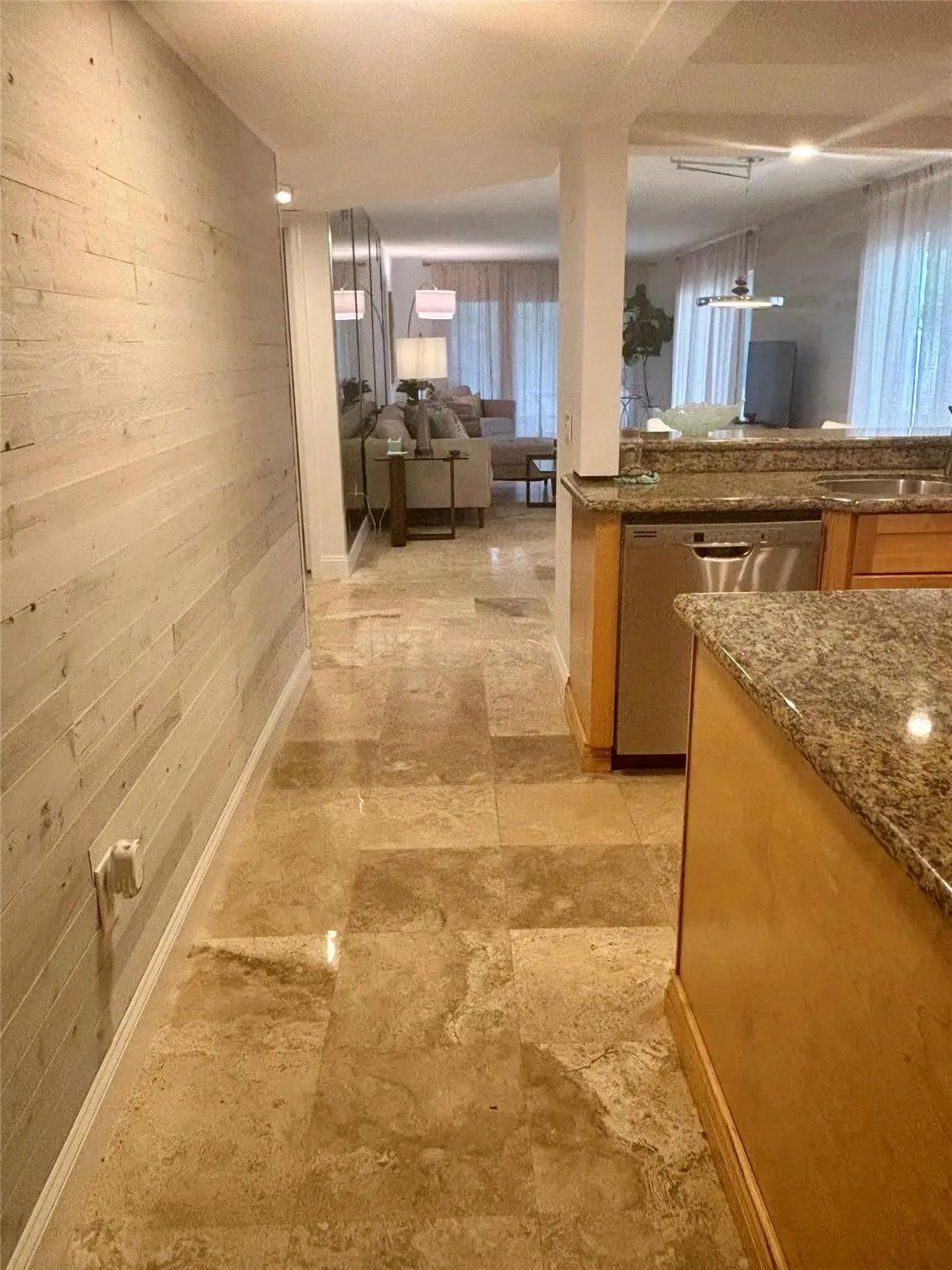 Entry with Shiplap WallMarble floors at 10980 S Ocean Drive 114, Jensen Beach