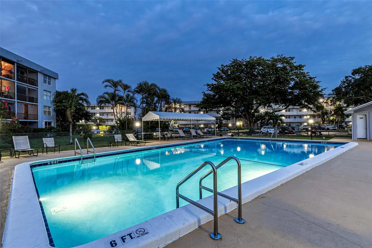 One of the pools at dusk at 112 Royal Park Drive 3d, Oakland Park