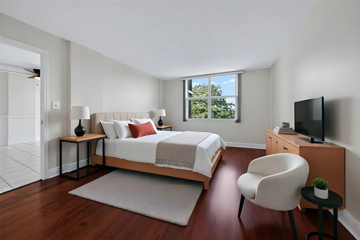 Primary bedroom virtually staged. at 112 Royal Park Drive 3d, Oakland Park