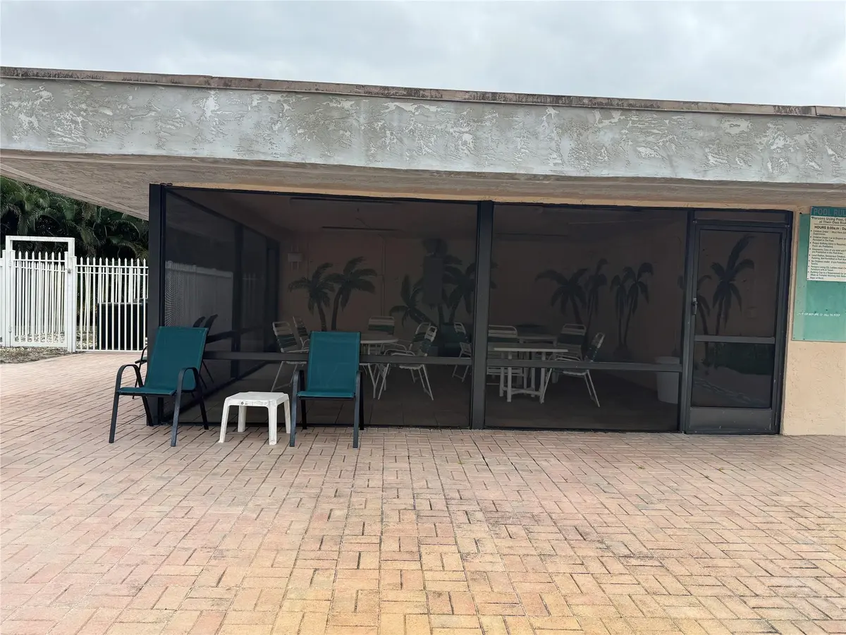 SCREENED IN EATINGAREA OFF POOL at 9300 SW 8th Street 215, Boca Raton