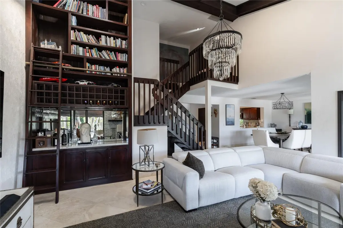 Library and wine rack bar area at 3182 Deer Creek Lake Shore Drive, Deerfield Beach