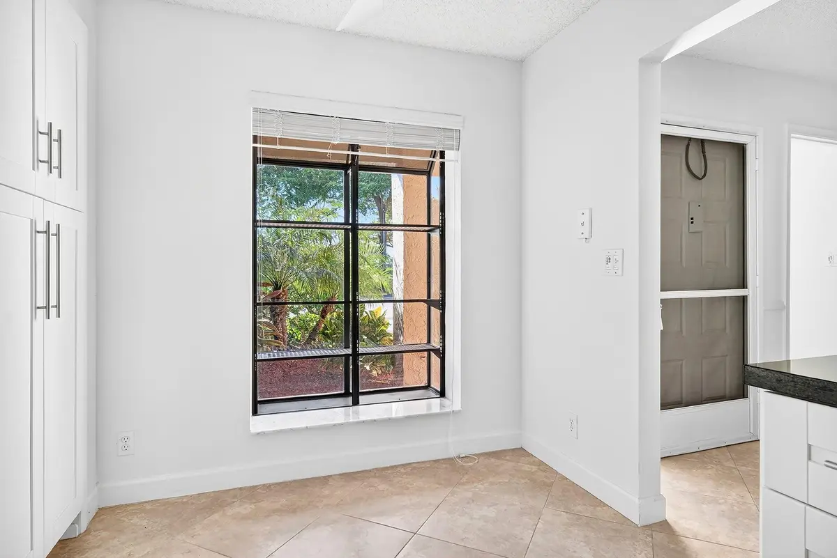 Breakfast table area at 5021 Oak Hill Lane 115, Delray Beach