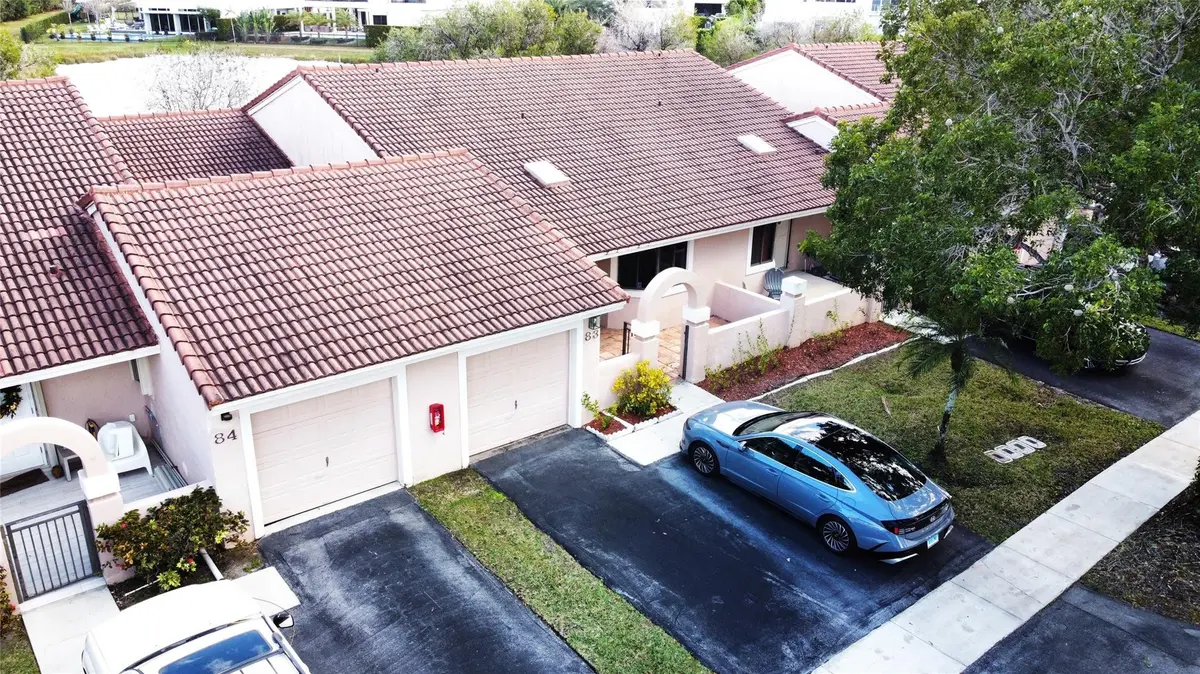 Photo 2 at 16600 Greens Edge Circle 83, Weston