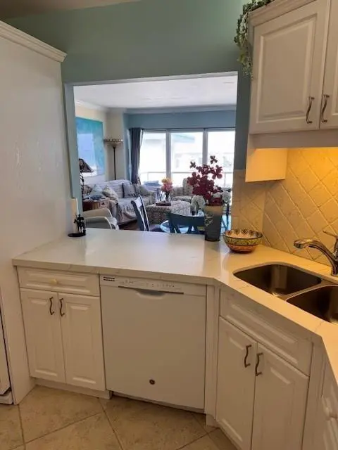 Countertops are white quartz at 111 N Pompano Beach Boulevard PH5, Pompano Beach