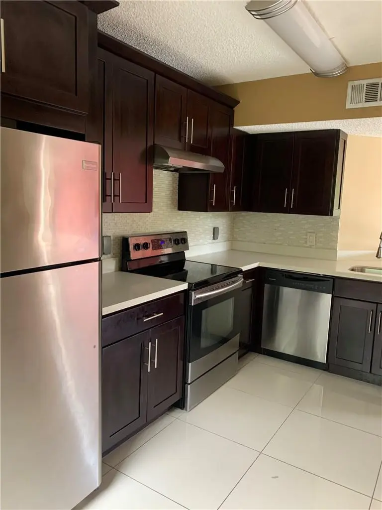 Photo 2 at 8891 Wiles Road 308, Coral Springs