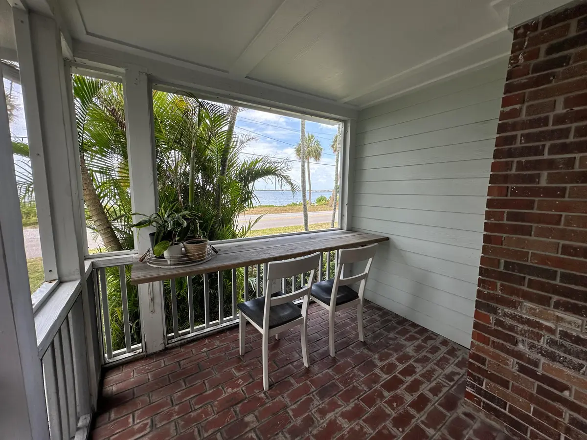 Front screened porch overlooking beach at 4490 NE Indian River Drive, Jensen Beach