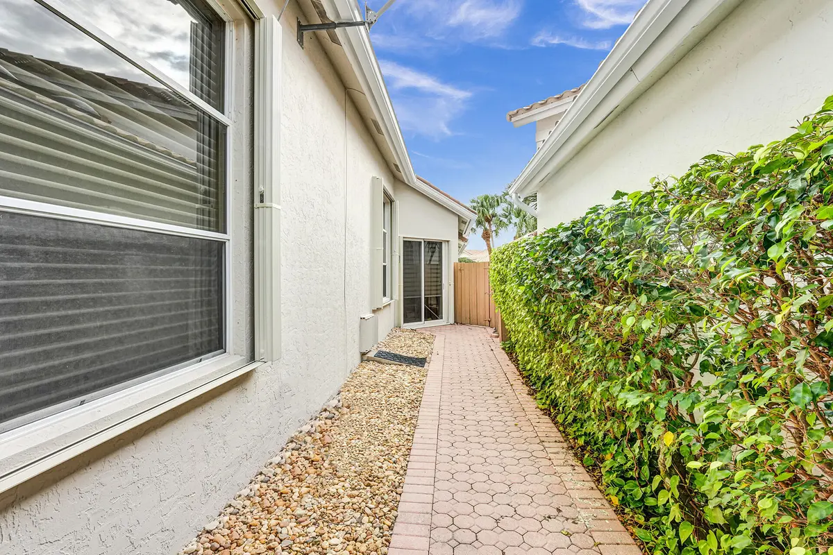 Walkway to the gate at 6675 NW 25th Way, Boca Raton