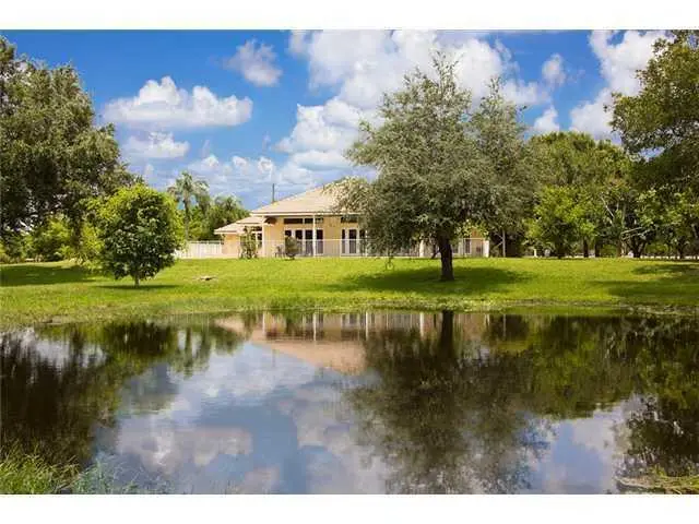 House and pond at 2088 Appaloosa Trail, Wellington