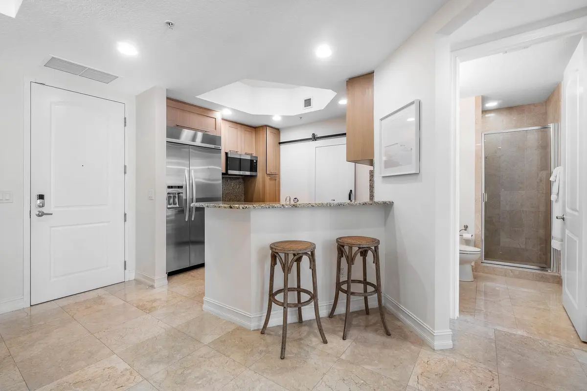 Kitchen w/ Eat-In Bar at 701 S Olive Avenue 1705, West Palm Beach