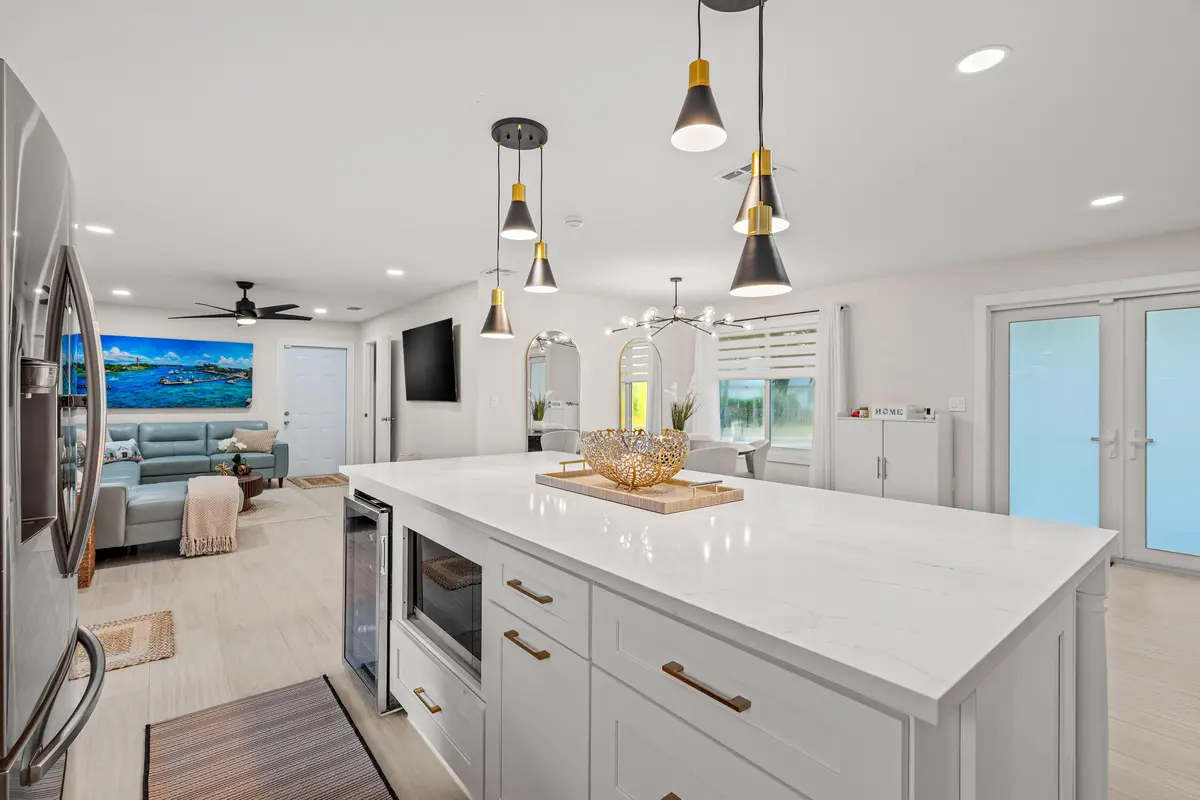 Kitchen + Family at 9165 SE Yacht Club Circle, Hobe Sound