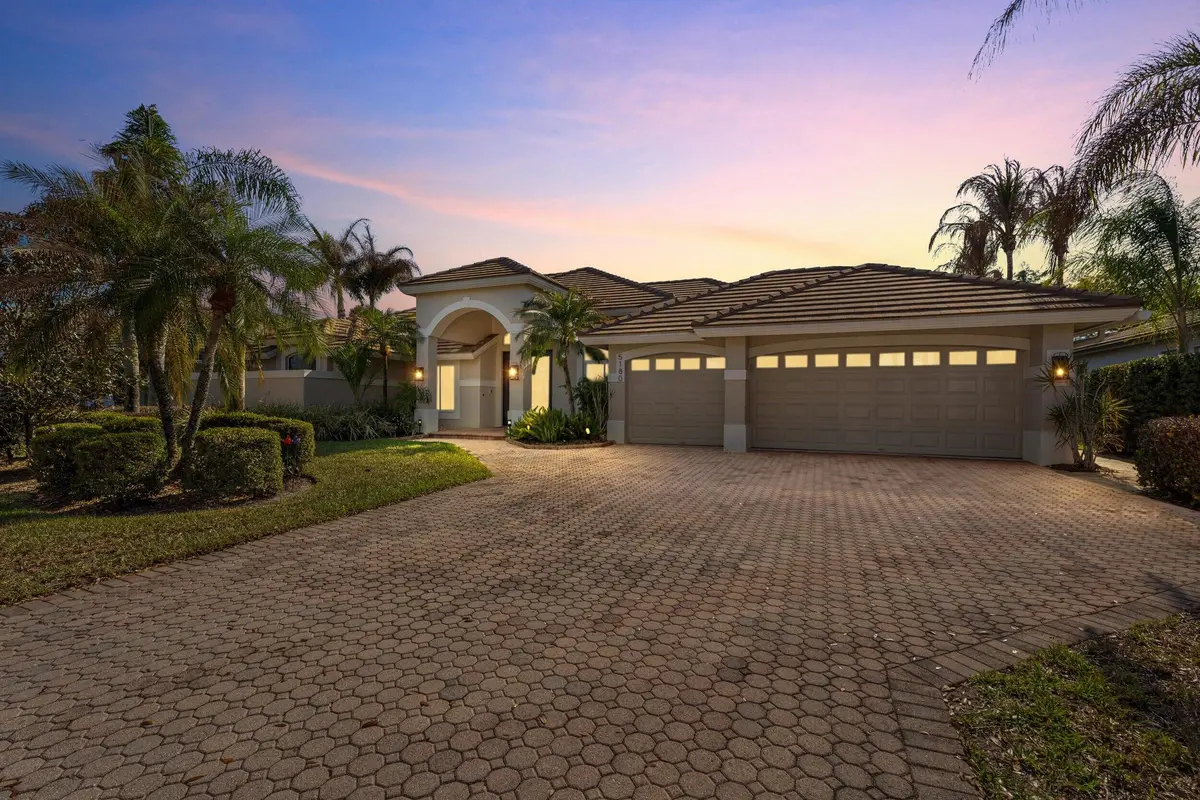 Front twilight at 5180 SW Hammock Creek Drive, Palm City