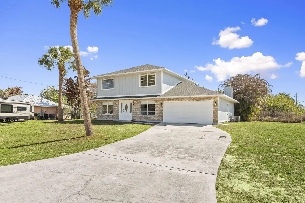 Curb Shot from street at 405 NE Midvale Street, Port St. Lucie