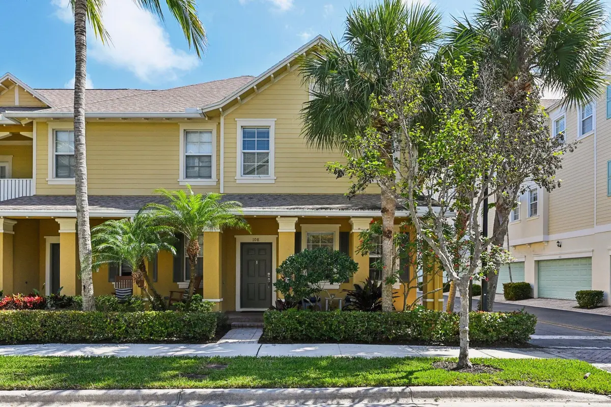 Front view and porch entry at 110 E Pigeon Plum Drive 108, Jupiter