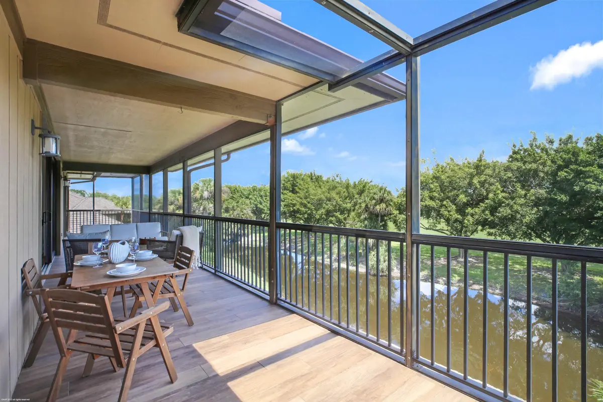 Screened balcony overlooking the water at 2770 Polo Island Drive B301, Wellington