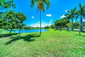 VIEW OF LAKE AND YARD at 435 SW Natura Avenue A, Deerfield Beach
