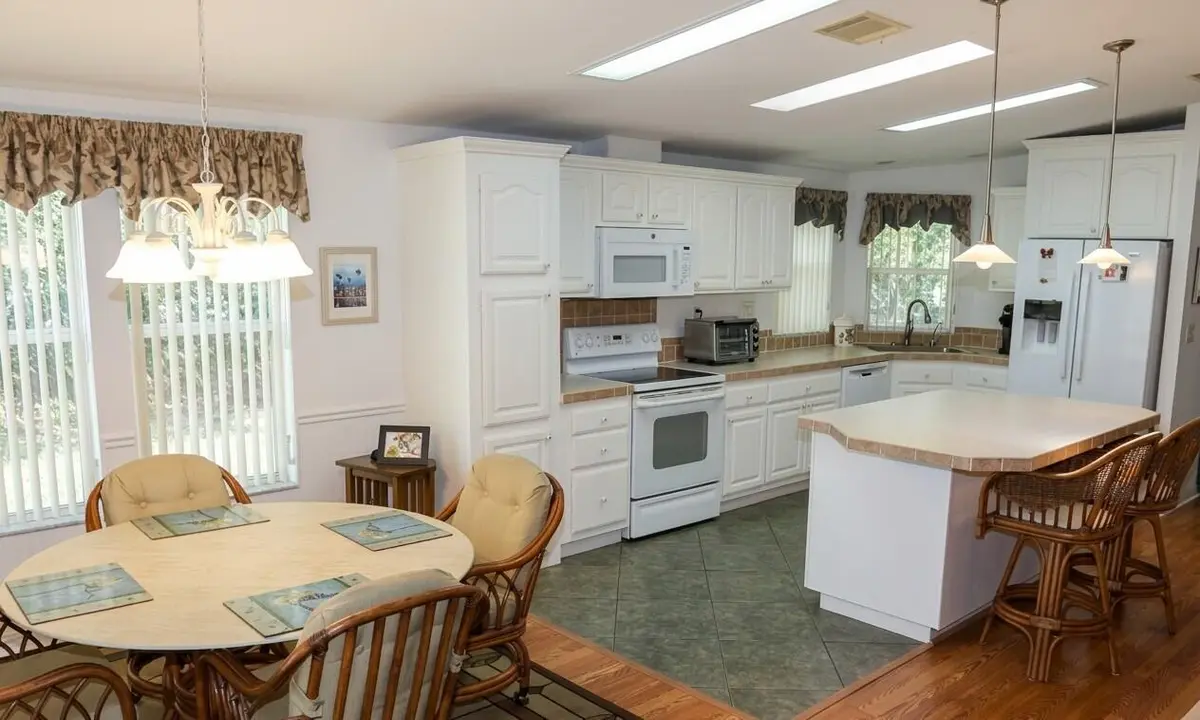 E - Breakfast area and kitchen at 3105 Palm Warbler Court, Port St. Lucie