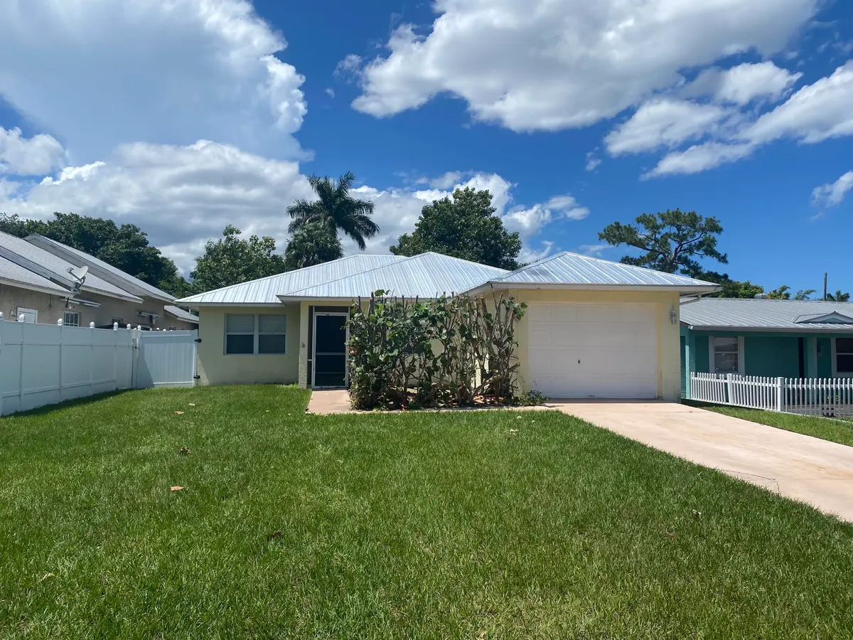 front at 1057 SW Spruce Street, Palm City