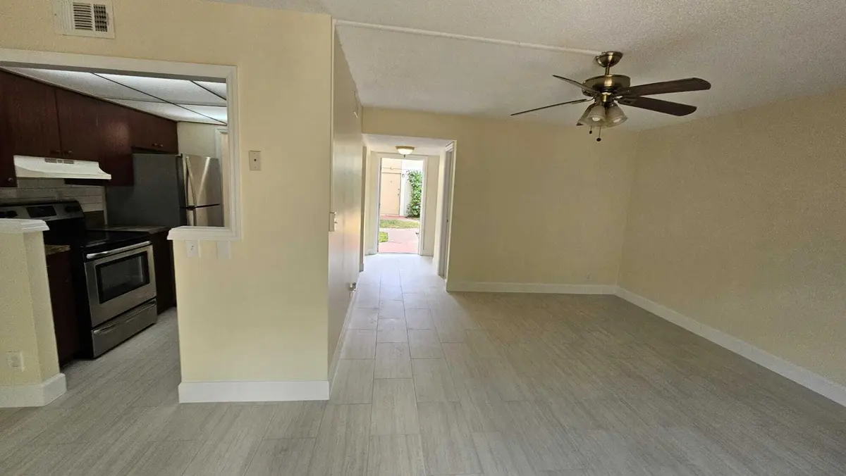 LIVING ROOM_5_8801 SAMPLE RD at 8801 W Sample Road 11, Coral Springs