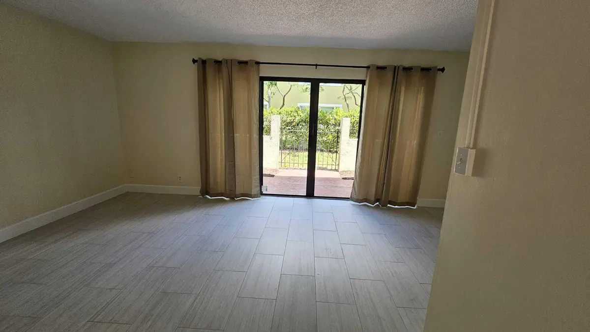 LIVING ROOM_2_8801 SAMPLE RD at 8801 W Sample Road 11, Coral Springs