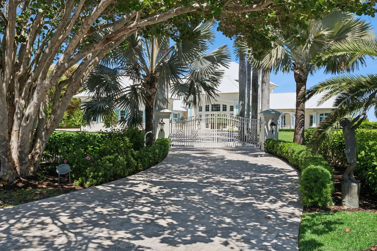 Front_Approach__Private_Drive__Lush_Trop at 716 Reef Road, Vero Beach
