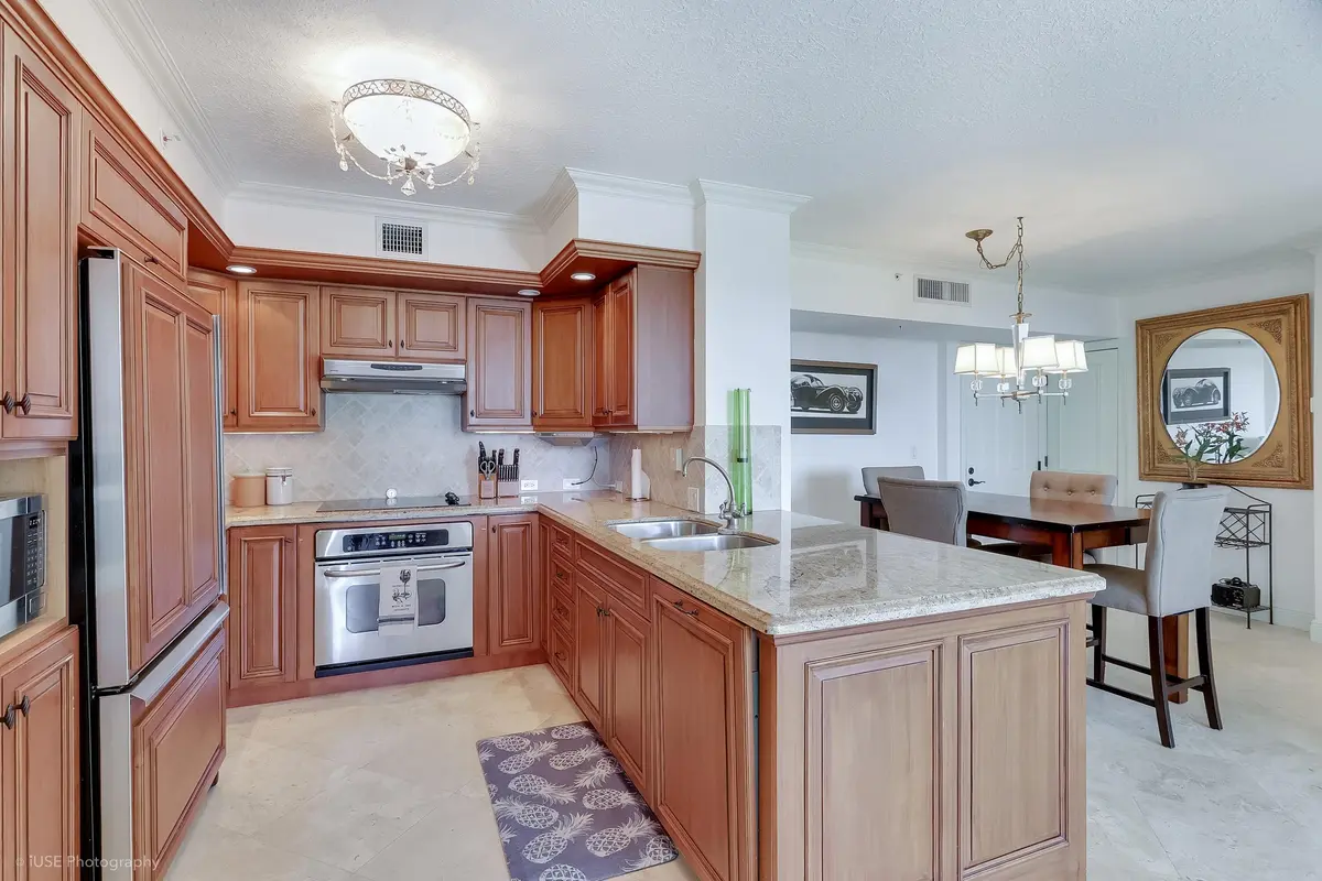 Kitchen to dining at 651 Okeechobee Boulevard 509, West Palm Beach