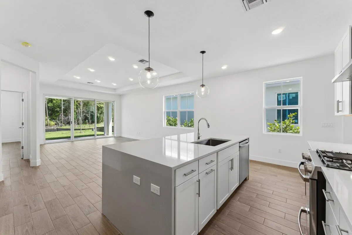 Kitchen, Dining Area & Great Room at 10091 NW Dreamweaver Road 52, Port St. Lucie