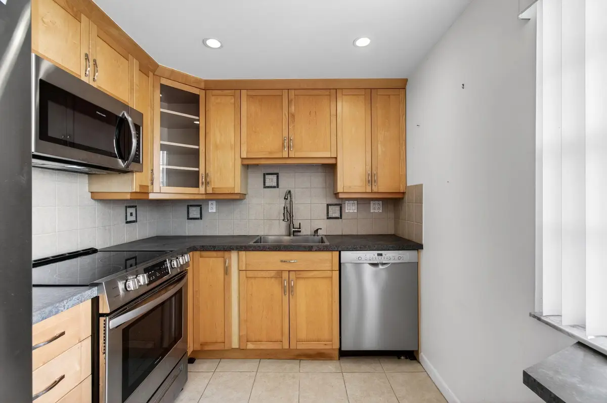 Spacious Kitchen with Sleek Counters at 167 Normandy D, Delray Beach