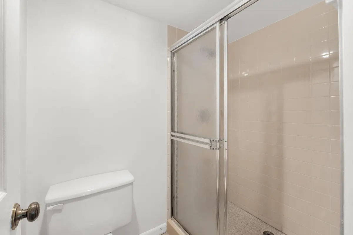 Primary bathroom shower at 3716 Whitehall Drive 202, West Palm Beach