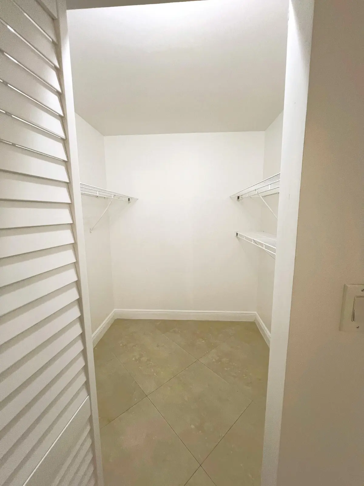 Main Bedroom Closet at 3001 Portofino Isle E2, Coconut Creek
