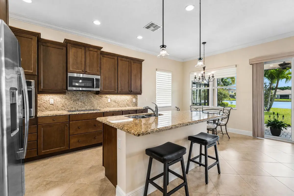 Spacious Kitchen w/ Sunrise View at 3028 Strada Court, Royal Palm Beach